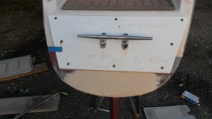 Repair chips in transom, and reinforce cleats