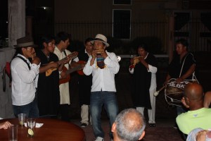 Entertainment at a group dinner at Pablo's house.