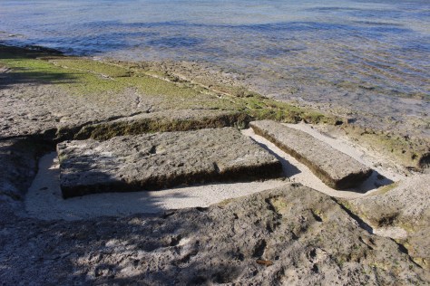 Slabs of coral rock were cut (somehow) by ancient Tongans, I believe for marking burial sites. 