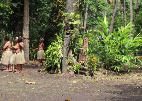 This is a photo of a boy with a coconut...look carefully.