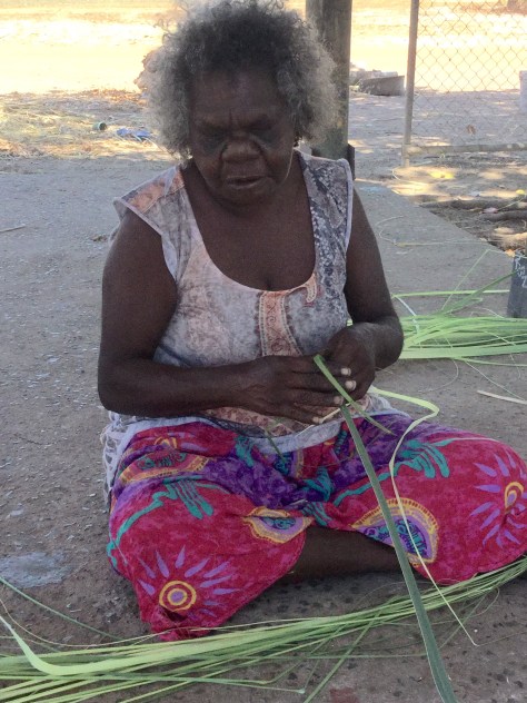 Preparing pandanus leaves for weaving.