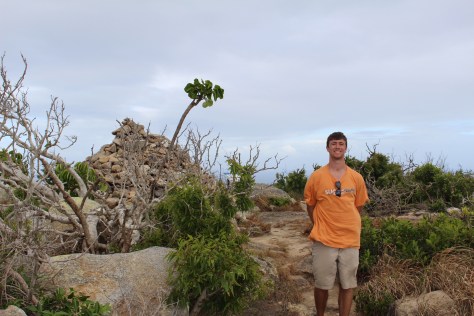 The cairn behind Jesse marks the summit and holds the box with the "guest book"