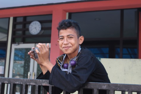 This kid was taking pictures of us, and was surprised when I aimed the camera at him.