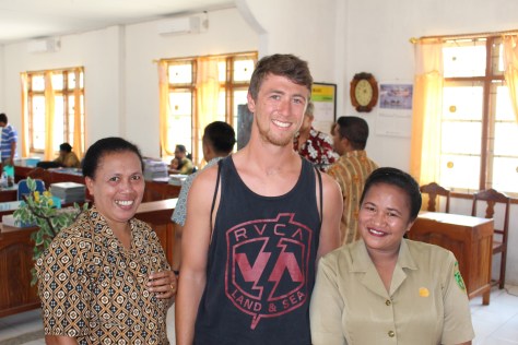 Into the teacher's lounge, where posing begins. Both teachers and students want their photos with the tall white people.