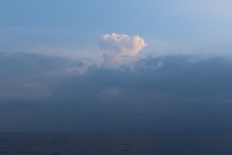Somewhere in there is the two mile high volcano on Lombok that erupted. Not sure if the cloud formation is related to the volcanic activity.