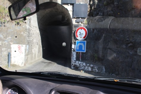In places the road narrows to one lane, as it does for this tunnel. In one we met a row of oncoming cars, and we had a standoff. We (and several cars entering behind us) had to back out.