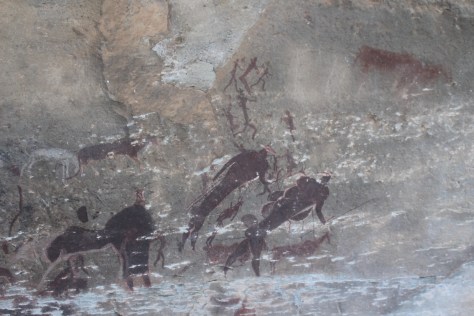 We also learn that (one theory says) this is a depiction done by the shamans after they use drugs to visit the spirit world, revealing what they see/experience. Intermixed human/animal bodies, one with 3 heads, one with 2 tails, but a happy human family suggesting that all is well...