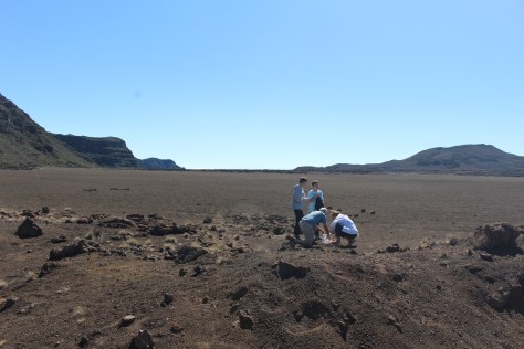 Collecting a sample from a moon-like sea of cinders