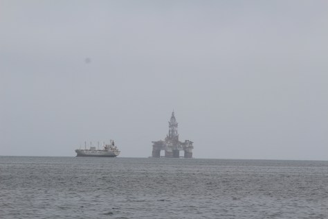 Leaving Walvis Bay; several oil rigs anchored in the harbor, waiting for the price of oil to go up, to make it worthwhile redloying them.