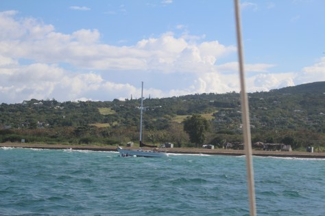 Boat broken loose from mooring and seconds from going into the surf