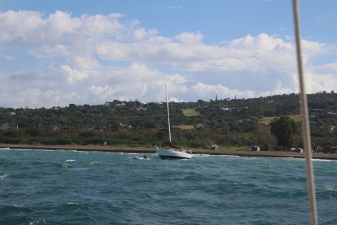 But the guys in the dinghy manage to turn it into the waves and tow it back out.